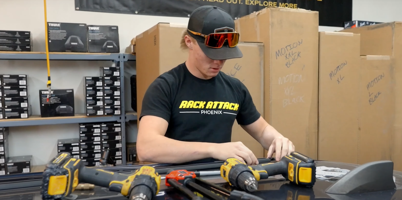 Custom rack being installed onto vehicle roof