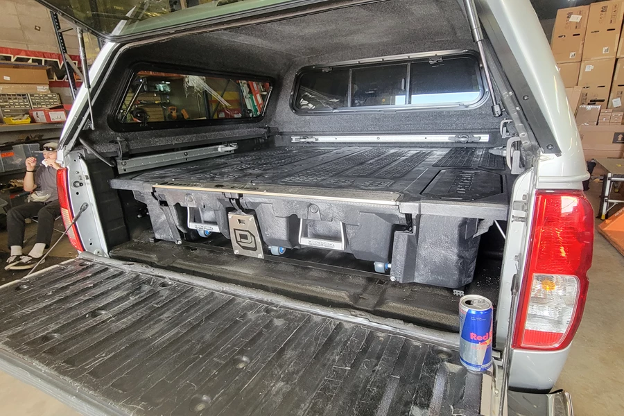 This beautiful 2011 Suzuki Equator got a Decked drawer system for storing all their gear in the bed of the truck.