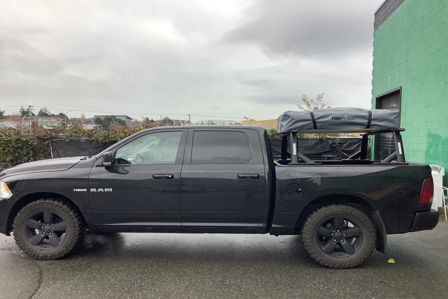 A Yakima Overhaul HD truck rack was installed on this 2010 Ram 1500 along with a Thule Tepui Explorer Kukenam 3 Rooftop tent