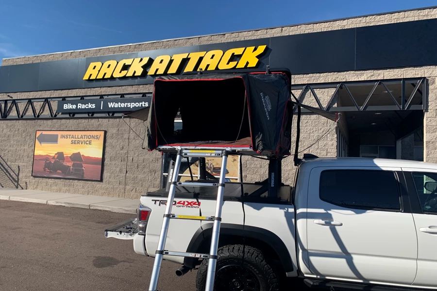 2020 Toyota Tacoma Double/Quad Cab with a Retrax XR and a beautiful truck bed setup for camping with the iKamper Mini Rocky Black