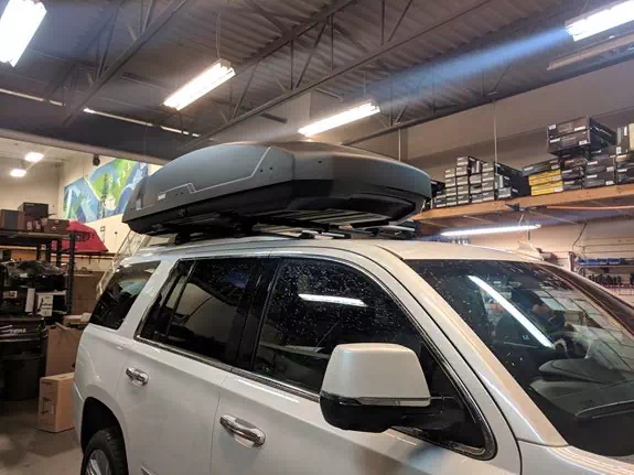 This a Thule Aeroblade roof rack with a  Force XT XXL and Snowpack 4 ski rack. 