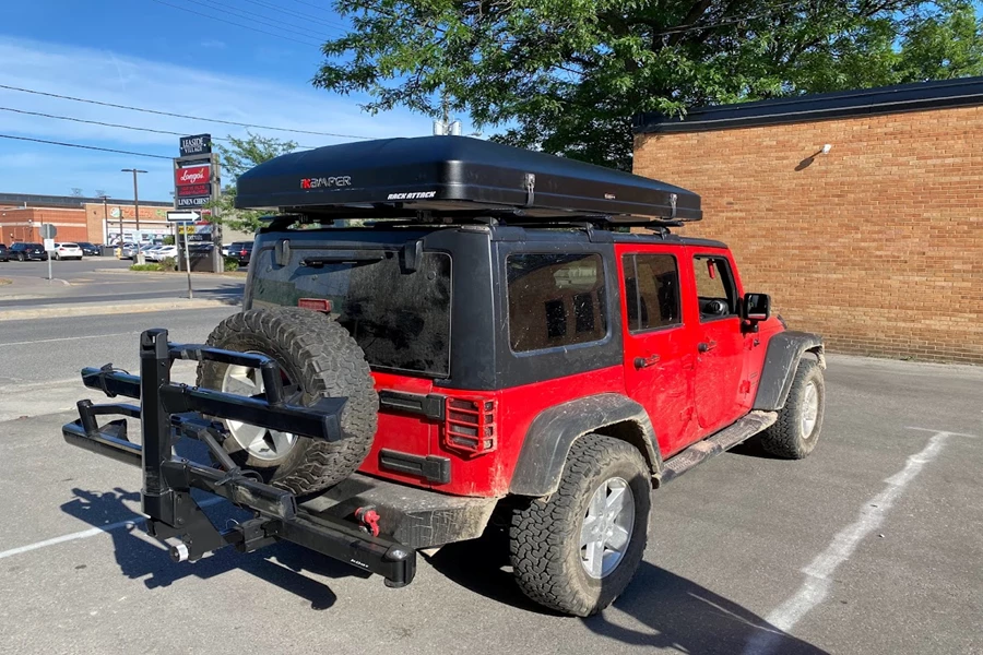 2017 Jeep Wrangler JK Unlimited 4DR with a Rhino Rack Backbone 3 Base Mounting System with a iKamper Skycamp 2.0 in Rocky Black